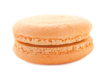 Delicious orange macaron on white background