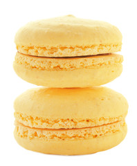 Delicious yellow macarons on white background
