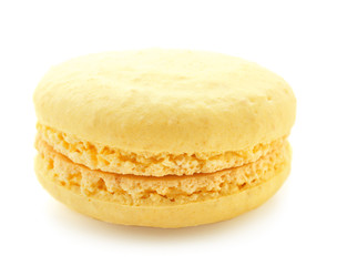 Fototapeta na wymiar Delicious yellow macaron on white background