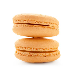Delicious orange macarons on white background