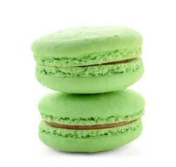 Delicious green macarons on white background