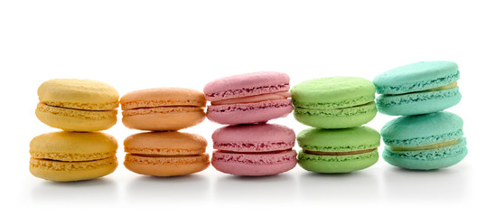 Delicious colorful macarons on white background