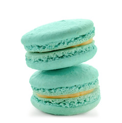 Delicious blue macarons on white background