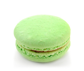 Delicious green macaron on white background
