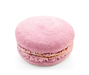 Delicious purple macaron on white background