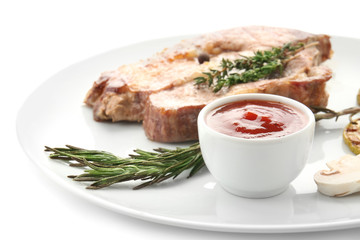 Plate with barbecue sauce and grilled meat on white background, closeup