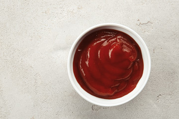 Delicious barbecue sauce in bowl on table, top view