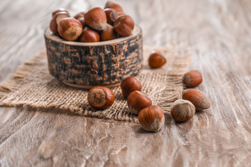 Tasty hazelnuts on wooden table