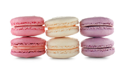 Tasty colorful macarons on white background