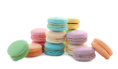 Tasty colorful macarons on white background
