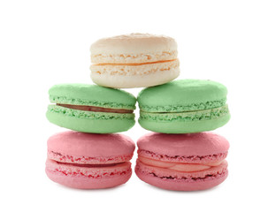 Tasty colorful macarons on white background