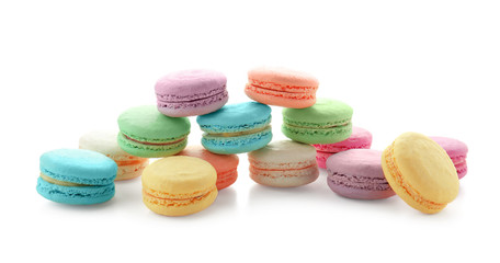 Tasty colorful macarons on white background