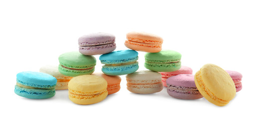 Tasty colorful macarons on white background