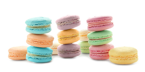 Tasty colorful macarons on white background