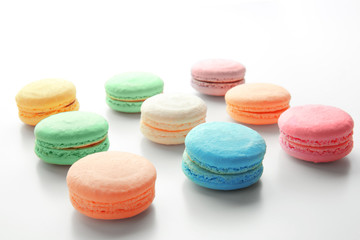 Fototapeta na wymiar Tasty colorful macarons on white background