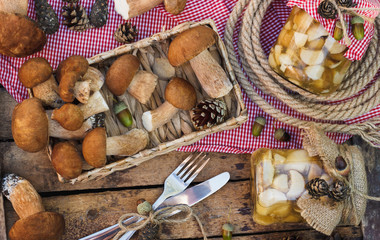 Raw white mushrooms, pine cones and decorations