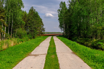 empty gravel road in the countryside in summer heat