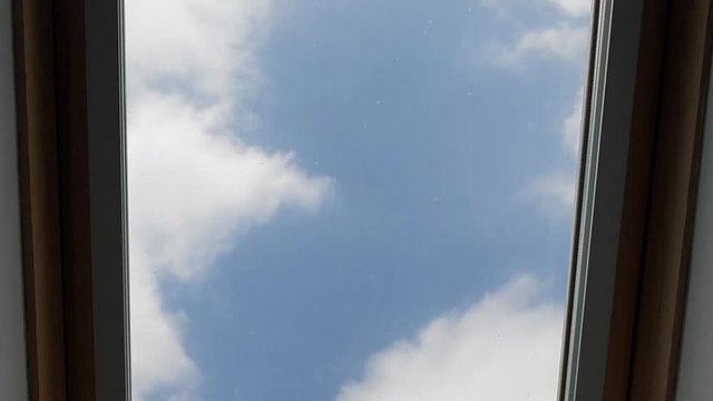 Time-lapse of clouds through bedroom window on a beautiful sunny day