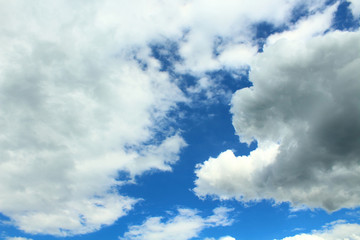 Fototapeta premium Beautiful blue sky and white fluffy cumulus clouds. Background. Landscape.