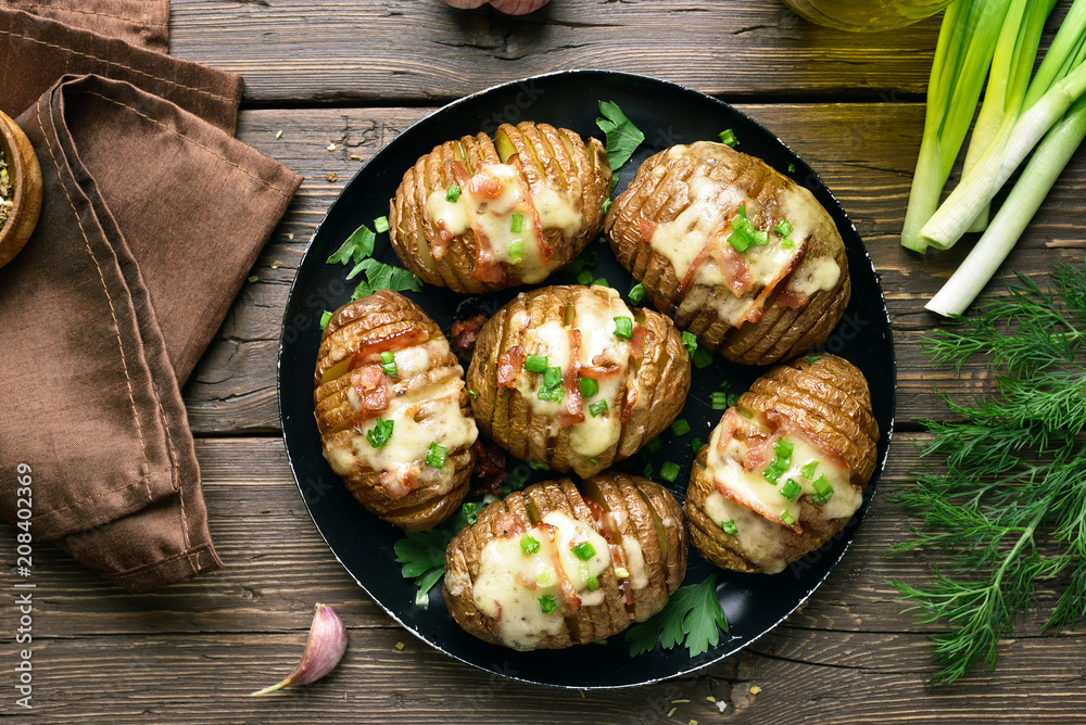 Wall mural baked stuffed potatoes with bacon, green onion and cheese