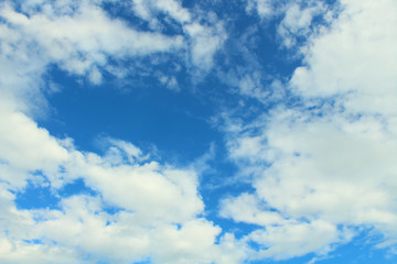 Beautiful blue sky and white fluffy cumulus clouds. Background. Landscape.