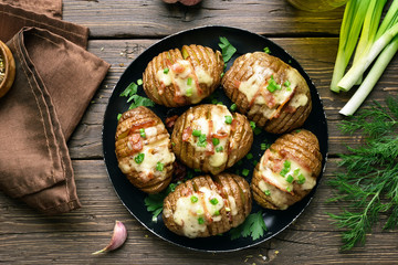 Baked stuffed potatoes with bacon, green onion and cheese