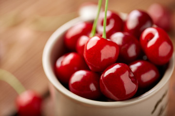 Fresh red cherry on a dark wooden background. Cherries. Healthy food concept.