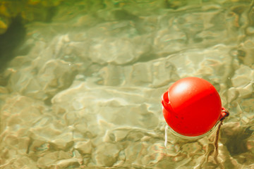 One red ball buoy