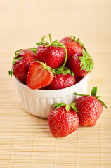 Fresh red strawberries on a wooden background. Summer berries. The concept of healthy eating.