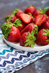 Fresh red strawberry on a dark abstract background. Summer berries. The concept of healthy eating.
