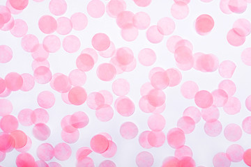 Pink confetti on white background