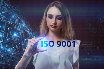 The concept of business, technology, the Internet and the network. A young entrepreneur working on a virtual screen of the future and sees the inscription: ISO 9001