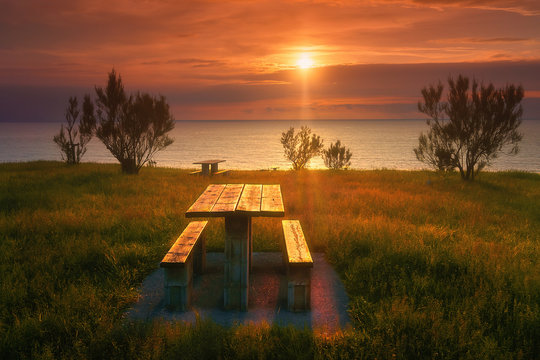 picnic table in Barrika coast at sunset