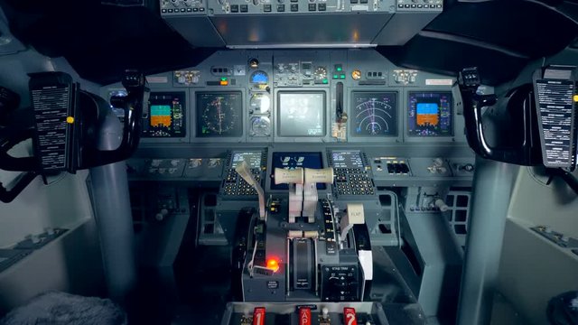 Close up of a throttle lever is transforming intro a general view of a plane's cockpit