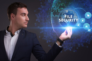 Business, Technology, Internet and network concept. Young businessman working on a virtual screen of the future and sees the inscription: File security