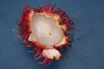Mamon Chino a tropical fruit native to Costa Rica with orange tendril skin and fleshy white inner fruit