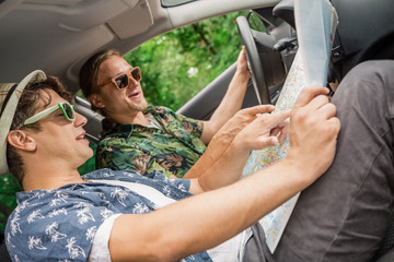 Hipster friends on road trip on summer day.