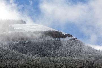 Fototapeta na wymiar Wyoming mountain after light snow with clouds