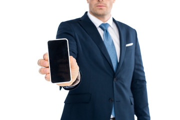 cropped shot of businessman holding smartphone with blank screen isolated on white