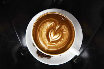 Coffee latte art with Leather sofa