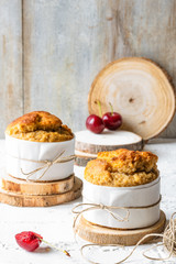 Homemade muffins with cherries. Rustic background