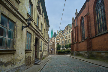 Creepy old medieval narrow street in Riga, Latvia.