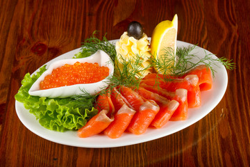 Sliced trout and red caviar
