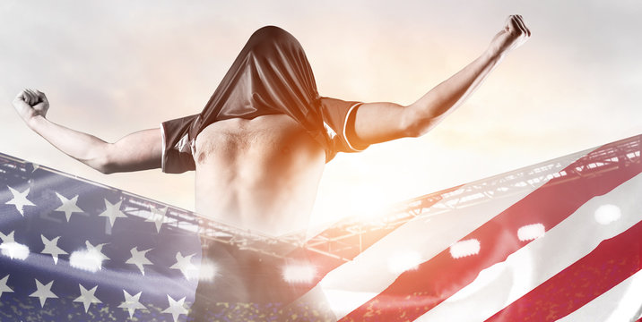 USA national team. Double exposure photo of stadium and soccer or football player celebrating goal with his jersey on head