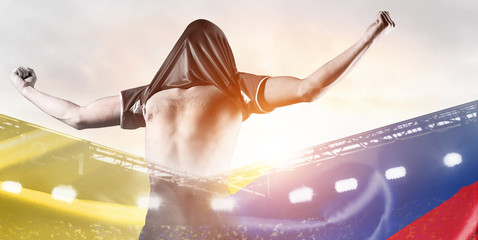 Colombia national team. Double exposure photo of stadium and soccer or football player celebrating goal with his jersey on head