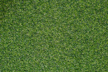 Obraz premium Artificial grass from football field Use as a beautiful green background.