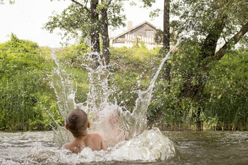children play with water in the river
