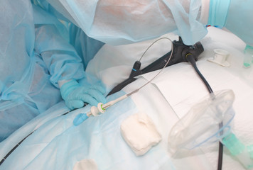 Medical workers team uring endoscopic procedure to the patient