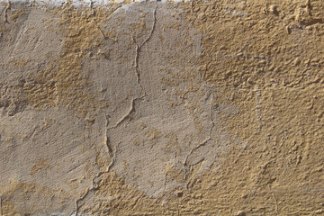Old stones wall covered with paint
