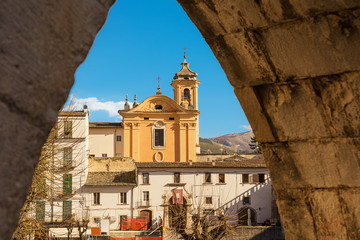 View from the arch of the aqueduct on the Piazza Garibaldi of Sulmona and people strolling